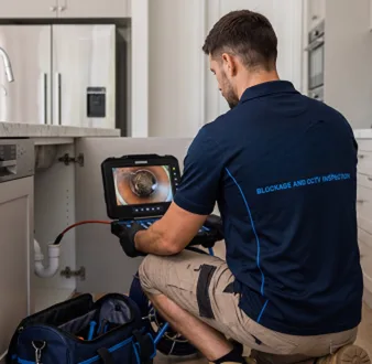 Clearing a blocked sink at a Caringbah property